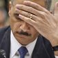 ** FILE ** Attorney General Eric H. Holder Jr. testifies on Capitol Hill in Washington on Thursday, Feb. 2, 2012, before the House Oversight and Government Reform Committee hearing titled &quot;Fast &amp; Furious: Management Failures at the Department of Justice.&quot; (AP Photo/J. Scott Applewhite)