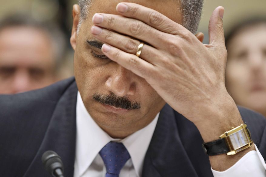** FILE ** Attorney General Eric H. Holder Jr. testifies on Capitol Hill in Washington on Thursday, Feb. 2, 2012, before the House Oversight and Government Reform Committee hearing titled "Fast & Furious: Management Failures at the Department of Justice." (AP Photo/J. Scott Applewhite)