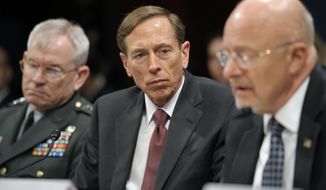 Army Lt. Gen. Ronald Burgess (left), Defense Intelligence Agency director; CIA Director David H. Petraeus (center); and James R. Clapper, director of national intelligence, testify on Capitol Hill in Washington on Thursday, Feb. 2, 2012, at a House Intelligence Committee hearing on worldwide threats. (AP Photo/Cliff Owen)