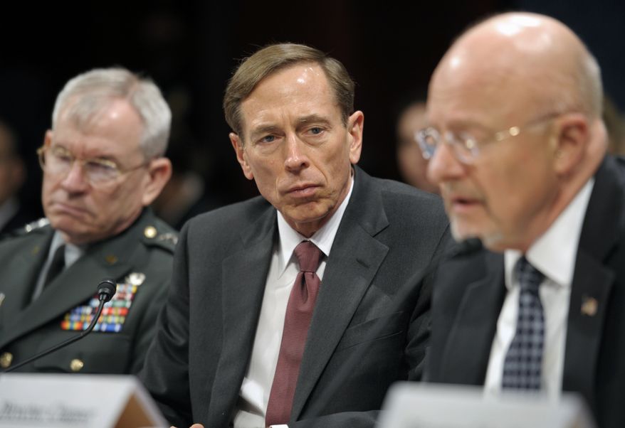 Army Lt. Gen. Ronald Burgess (left), Defense Intelligence Agency director; CIA Director David H. Petraeus (center); and James R. Clapper, director of national intelligence, testify on Capitol Hill in Washington on Thursday, Feb. 2, 2012, at a House Intelligence Committee hearing on worldwide threats. (AP Photo/Cliff Owen)