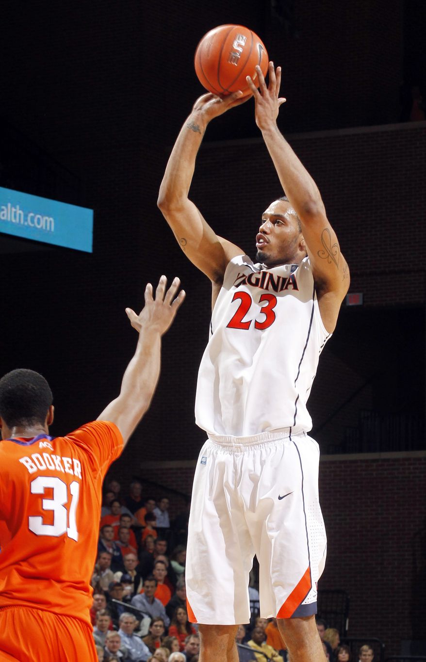 Virginia forward Mike Scott is averaging 17.0 points, 8.3 rebounds and 1.5 assists per game this season. (AP Photo/Andrew Shurtleff)