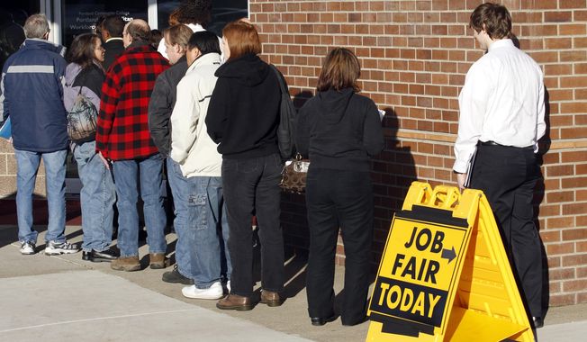 ** FILE ** This Jan. 12, 2012, photo shows people waiting in line at a job fair employer hiring event for Safeway in Portland, Ore. (AP Photo/Rick Bowmer)

