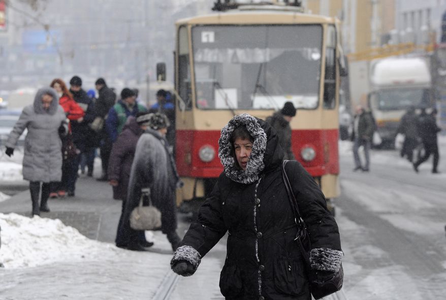 A pedestrian walks Feb. 3, 2012, on a street in Kiev. (Associated Press)