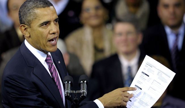 President Barack Obama holds up a proposed mortgage application form as he speaks at the James Lee Community Center in Falls Church, Va., Wednesday, Feb. 1, 2012. (AP Photo/Cliff Owen)