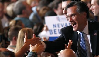 Republican presidential candidate and former Massachusetts Gov. Mitt Romney greets supporters Feb. 4, 2012, at his Nevada caucus night victory celebration in Las Vegas. (Associated Press)