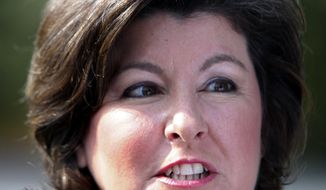 **FILE** Georgia gubernatorial candidate Karen Handel speaks Aug. 10, 2010, to reporters after casting her ballot in the Georgia runoff election in Roswell, Ga. (Associated Press)