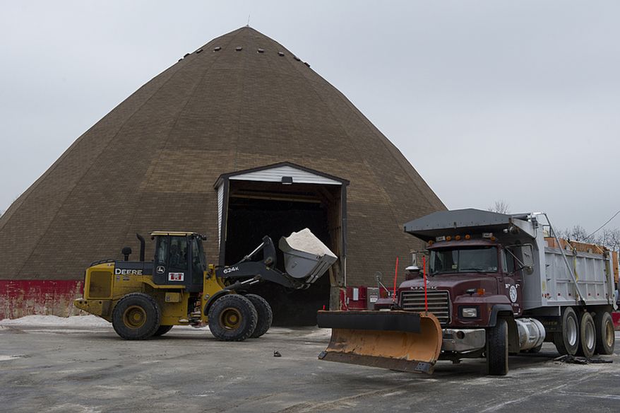 A snowplow is loaded with salt at the Virginia Department of Transportation's Van Dorn headquarters in Alexandria on Wednesday, Feb. 8, 2012, in anticipation of a wintry mix in the evening. The weather predictions call for possibly a dusting of snow in the Washington area, with up to 2 inches in outlying areas. (Barbara L. Salisbury/The Washington Times)