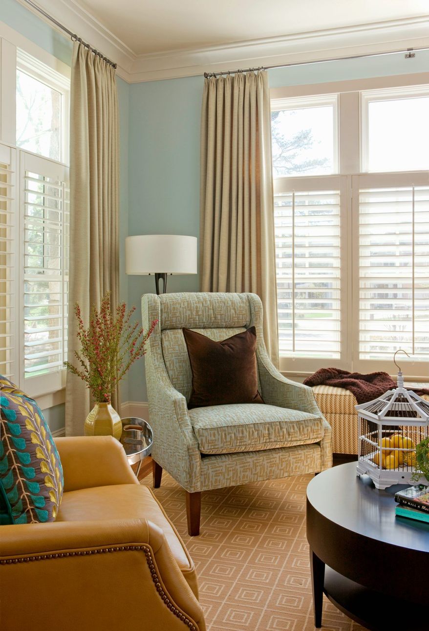 Photo by Angie Seckinger Photography
Layering window treatments, such as using plantation shutters along with draperies can increase energy efficiency as well as add style.