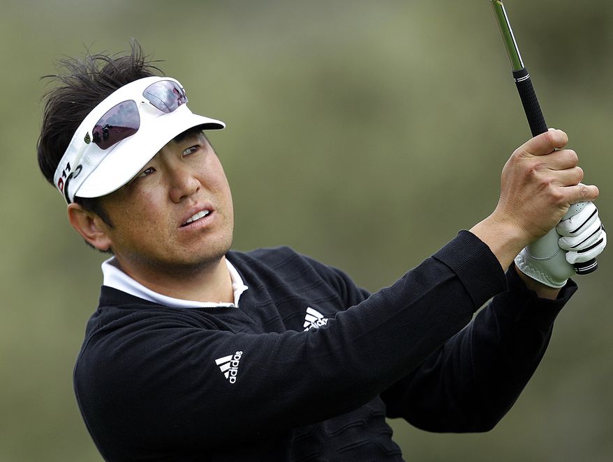 Charlie Wi follows his shot off the 17th tee of the Pebble Beach Golf Links during the second round of the Pebble Beach National Pro-Am golf tournament Friday, Feb. 10, 2012, in Pebble Beach, Calif. (AP Photo/Ben Margot)