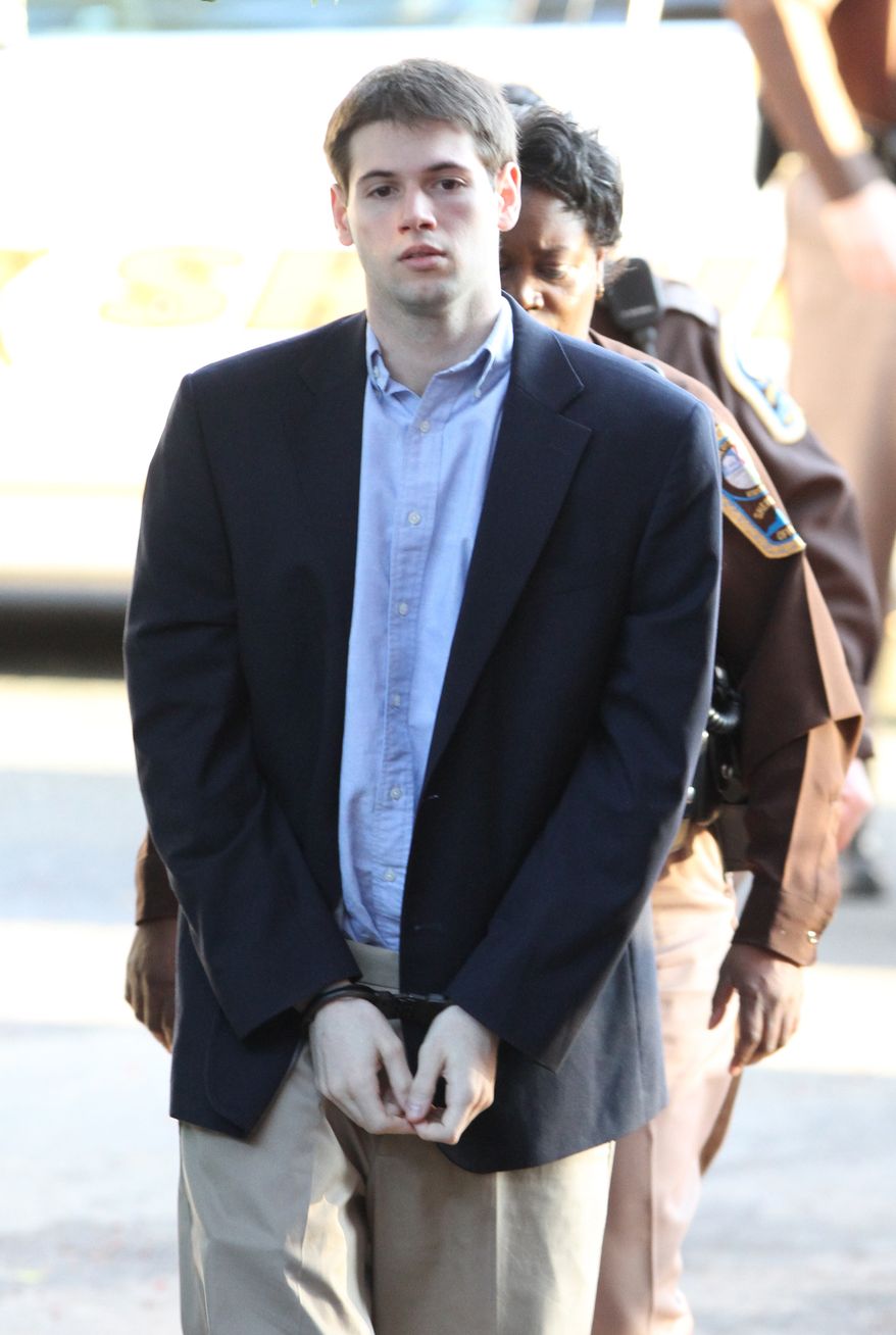 George Huguely V is escorted to Charlottesville Circuit Court by members of the Charlottesville Sheriff's Office for the start of his trial in Charlottesville, Va, Thursday, Feb. 9, 2012. Huguely, is charged with the murder of fellow University of Virginia senior Yeardley Love. (AP Photo/The Daily Progress, Sabrina Schaeffer)