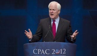 Sen. John Cornyn, R-Texas, criticizes U.S. Attorney General Eric Holder as he speaks to activists from America&#39;s political right at the Conservative Political Action Conference (CPAC) in Washington, Saturday, Feb. 11, 2012. (AP Photo/J. Scott Applewhite)