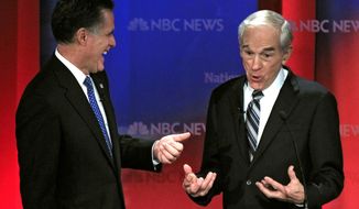 ** FILE ** In this Jan. 23, 2012, file photo, Republican presidential candidates, Rep. Ron Paul, R-Texas, right, and former Massachusetts Gov. Mitt Romney share a laugh during a break in a Republican presidential debate at the University of South Florida in Tampa, Fla. (AP Photo/Chris O&#39;Meara, File)