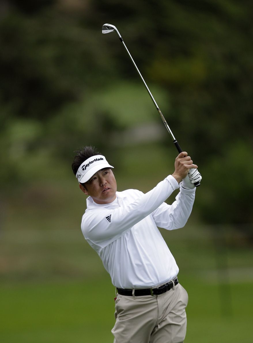 Charlie Wi hits off the first fairway of the Spyglass Hill golf course during the third round of the Pebble Beach National Pro-Am golf tournament Saturday, Feb. 11, 2012, in Pebble Beach, Calif. (AP Photo/Ben Margot)