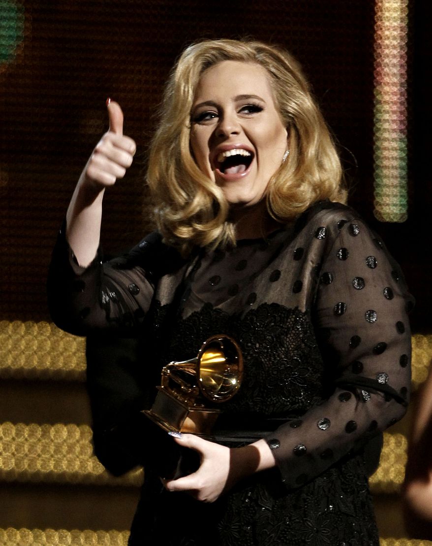 Adele accepts the award for record of the year for "Rolling in the Deep" during the 54th annual Grammy Awards on Sunday, Feb. 12, 2012 in Los Angeles. (AP Photo/Matt Sayles)