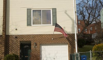 A house in Southeast D.C. is the address Emmanuel Bailey gave to register his company, Veteran Service Corp., but the duplex is his mother's home. (Barbara L. Salisbury/The Washington Times)