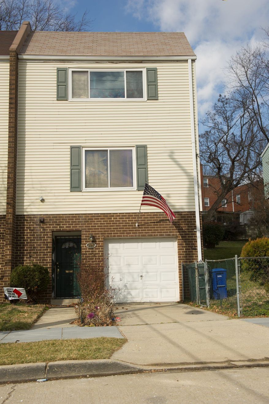 A house in Southeast D.C. is the address Emmanuel Bailey gave to register his company, Veteran Service Corp., but the duplex is his mother's home. (Barbara L. Salisbury/The Washington Times)