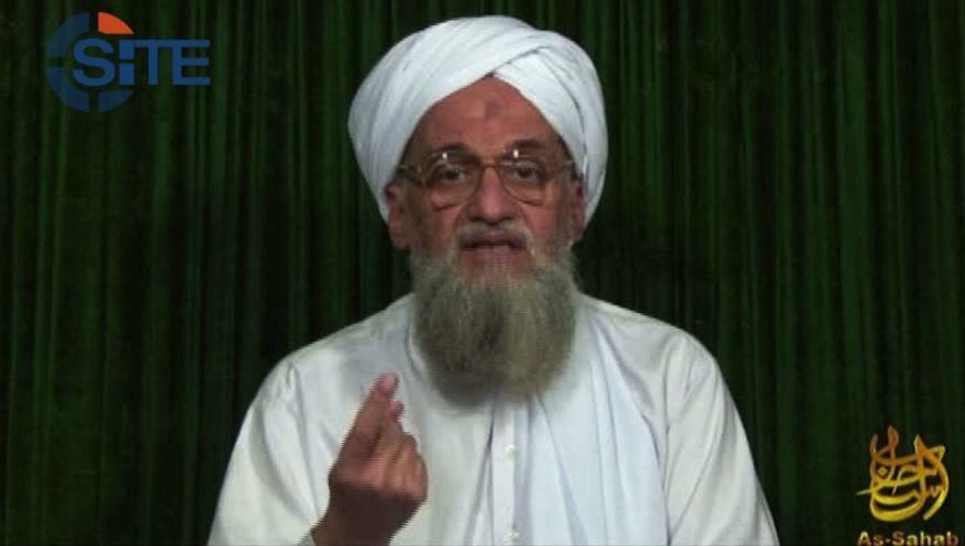 ** FILE ** This frame-grabbed image from video provided by the SITE Intel Group, an U.S. private terrorist-threat-analysis company, purports to show al Qaeda leader Ayman al-Zawahri on a Web posting on Sunday, Feb. 12, 2012. (AP Photo/SITE Intel Group)