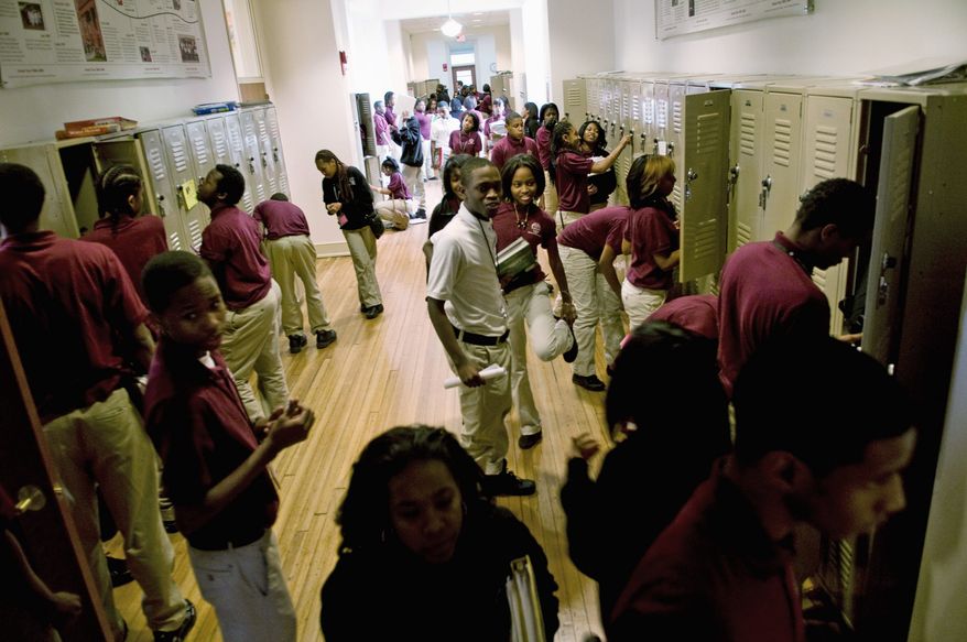 Students change classes on Dec. 8, 2010, at the Thurgood Marshall Academy Public Charter High School in the Anacostia neighborhood of Washington. (J.M. Eddins/The Washington Times) ** FILE **