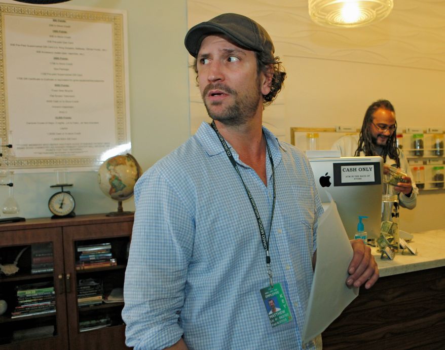 Matthew Huron, owner of two medical-marijuana dispensaries and an edible-marijuana company in Denver, pays his bills with money orders. That's because processing transactions or investments with pot money puts federally insured banks at risk of federal drug-racketeering charges. Mr. Huron's business is cash-only. (Associated Press)