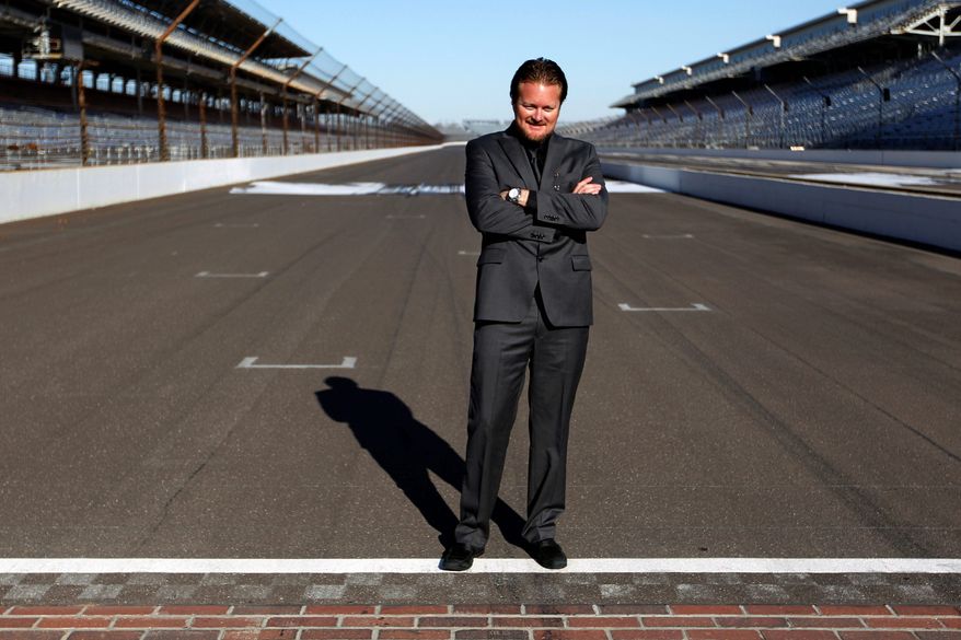 FILE - In this Jan. 4, 2012, file photo, Beaux Barfield poses on the start/finish line after he was named to replace Brian Barnhart as the IndyCar race director during an announcement at the Indianapolis Motor Speedway in Indianapolis. With the IndyCar Series still recovering from Dan Wheldon's death, Barfield said Tuesday, Feb. 14, 2012, double-file restarts would be scrapped at Indianapolis, Texas and Fontana and more changes to improve safety could be announced before next month's season-opener at St. Petersburg. (AP Photo/Michael Conroy, File)