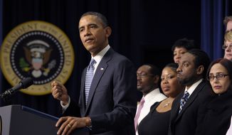 President Obama pushes Congress to extend the payroll-tax cut and unemployment insurance through the end of the year during a speech on Tuesday, Feb. 14, 2012, in Washington. (AP Photo/Susan Walsh)