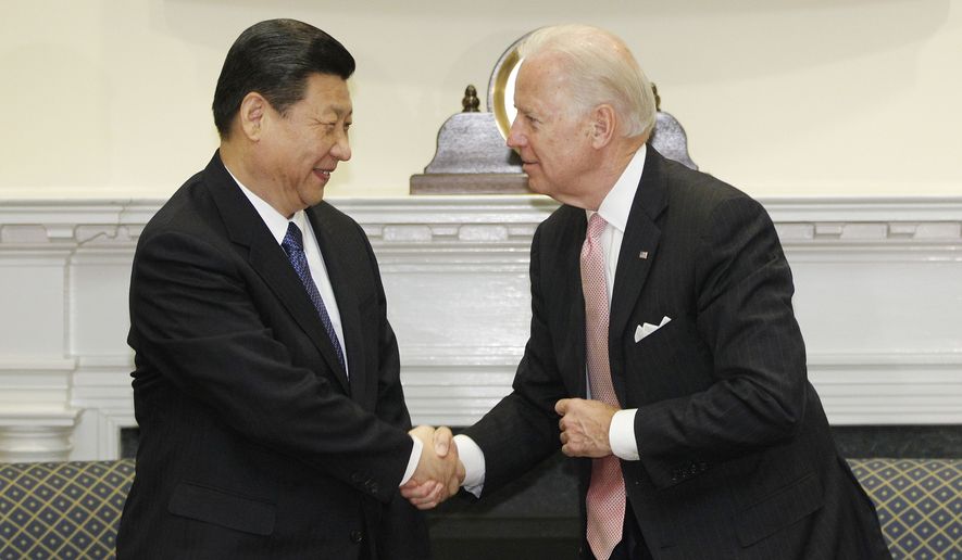 Vice President Joseph R. Biden Jr. meets with Chinese Vice President Xi Jinping in the Roosevelt Room at the White House in Washington on Tuesday, Feb. 14, 2012. (AP Photo/Charles Dharapak)

