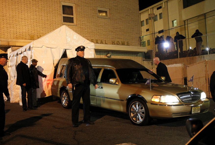 The body of Whitney Houston arrives at the Whigham Funeral Home in Newark, N.J., on Monday, Feb. 13, 2012. (AP Photo/Rich Schultz)