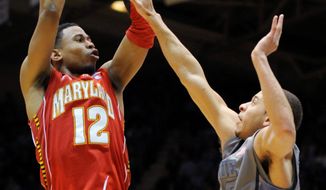 **FILE** Maryland&#39;s Terrell Stoglin (12) shoots over Duke&#39;s Seth Curry during the Terps&#39; 73-55 loss at Duke on Feb. 11, 2012. (Associated Press)