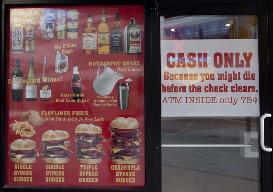The Heart Attack Grill in Las Vegas offers such fare as "bypass" burgers, "flatliner" fries and "butterfat" shakes on its menu. (AP Photo/Julie Jacobson)