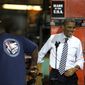 President Obama shakes hands with DiAndre Jackson as he is introduced Feb. 15, 2012, at the Master Lock Company in Milwaukee, where he spoke about the importance of American manufacturing. (Associated Press)