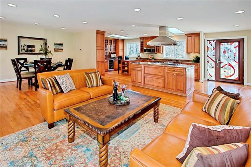 The homeowners removed walls to create a large, open space where the kitchen, dining room and living room blend into each other.