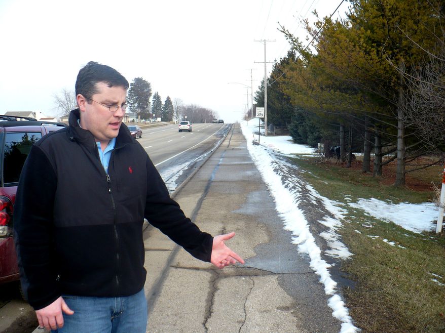 On Wednesday, Feb. 15, 2012, Mike Vega points to the area in Madison, Wis., where on Feb. 6 he found a severely malnourished 15-year-old after she had escaped from an unfinished basement in which, authorities say, she was forced to stay for years. (AP Photo/Todd Richmond)