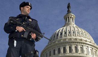 Capitol Police officer Angel Morales stands on guard Feb. 17, 2012, on the west side of the U.S. Capitol in Washington, after a 29-year-old Moroccan man was arrested in an FBI sting operation near the Capitol while planning to detonate what police say he thought were live explosives. (Associated Press)