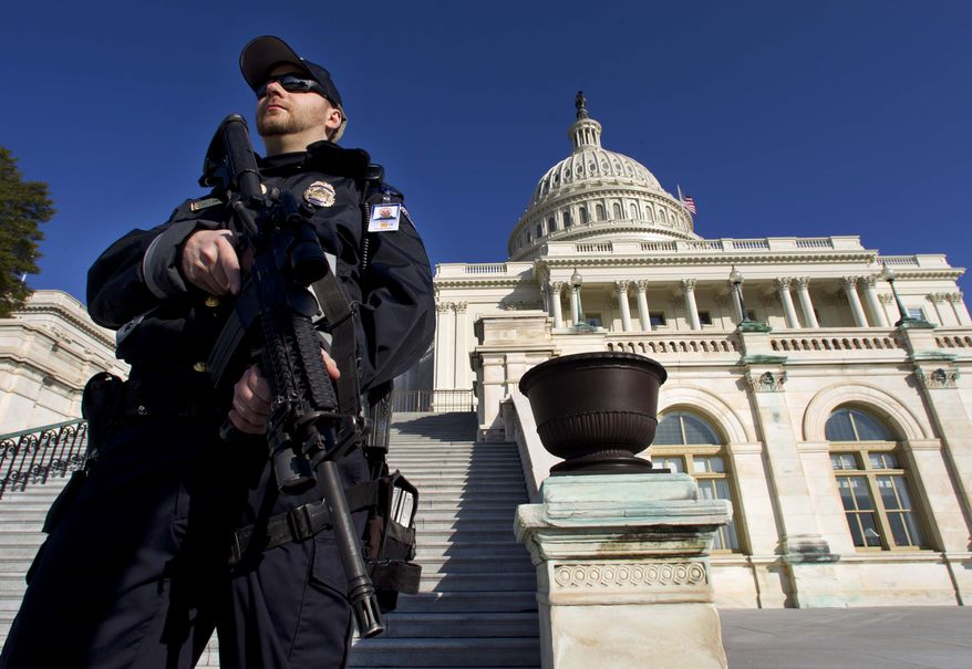 Capitol Police officer Trevor O'Neill stands on guard on the west side of the Capitol in Washington Friday, Feb. 17, 2012. A 29-year-old Moroccan man was arrested Friday in an FBI sting operation near the U.S. Capitol while planning to detonate what police say he thought were live explosives. (AP Photo/Manuel Balce Ceneta)