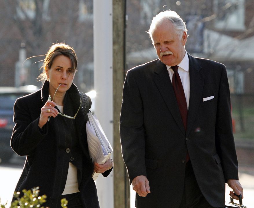 Defense attorneys Rhonda Quagliana, left, and Francis McQ. Lawrence, right, walk into the Charlottesville Circuit courthouse for George W. Huguely V's trial in Charlottesville, Va. on Saturday, Feb. 18, 2012. (AP Photo/Norm Shafer)