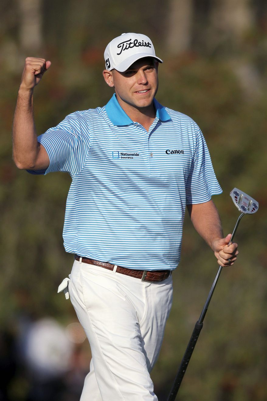 Bill Haas celebrates his putt on the second playoff hole that gave him the victory in the Northern Trust Open. (Associated Press)