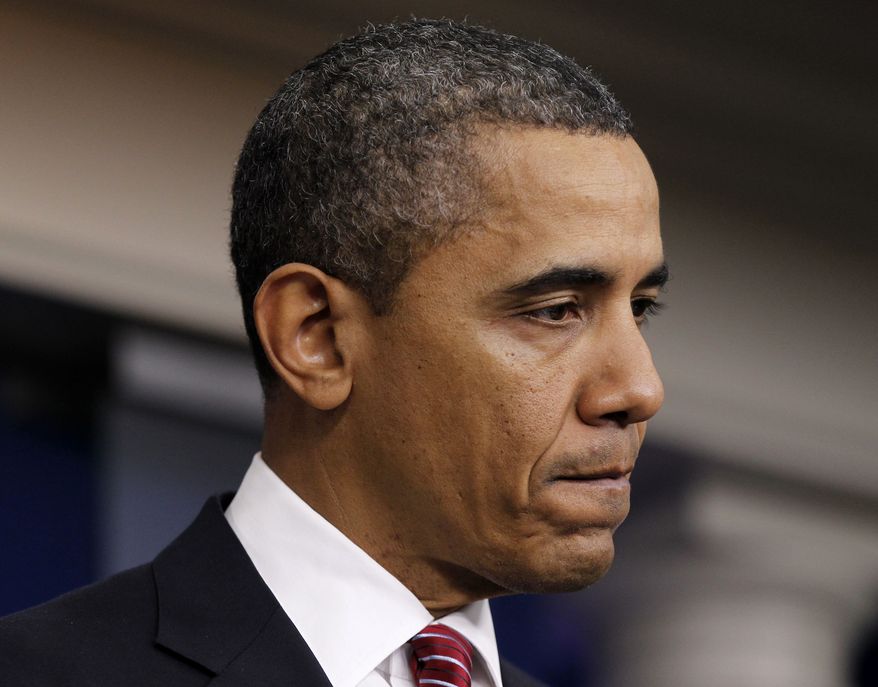 President Barack Obama pauses while announcing the revamp of his contraception policy requiring religious institutions to fully pay for birth control, Friday, Feb. 10, 2012, in the Brady Press Briefing Room of the White House in Washington. (AP Photo/Pablo Martinez Monsivais)