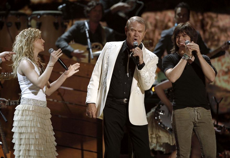 ** FILE ** Kimberly Perry, left, Glen Campbell, center, and Reid Perry perform during the 54th annual Grammy Awards on Sunday, Feb. 12, 2012, in Los Angeles. (AP Photo/Matt Sayles)
