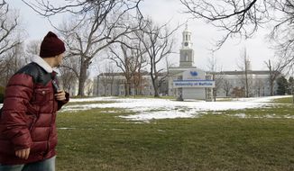 **FILE** A person walks Feb. 15, 2012, on the University at Buffalo campus in Buffalo, N.Y. (Associated Press)
