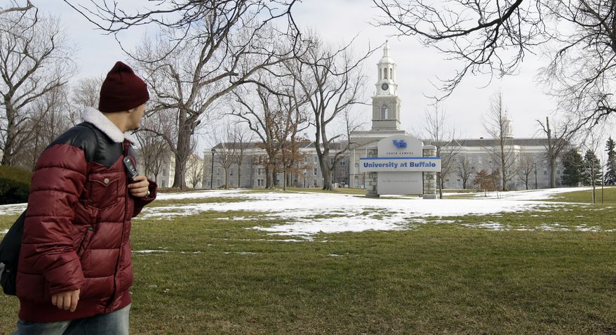**FILE** A person walks Feb. 15, 2012, on the University at Buffalo campus in Buffalo, N.Y. (Associated Press)