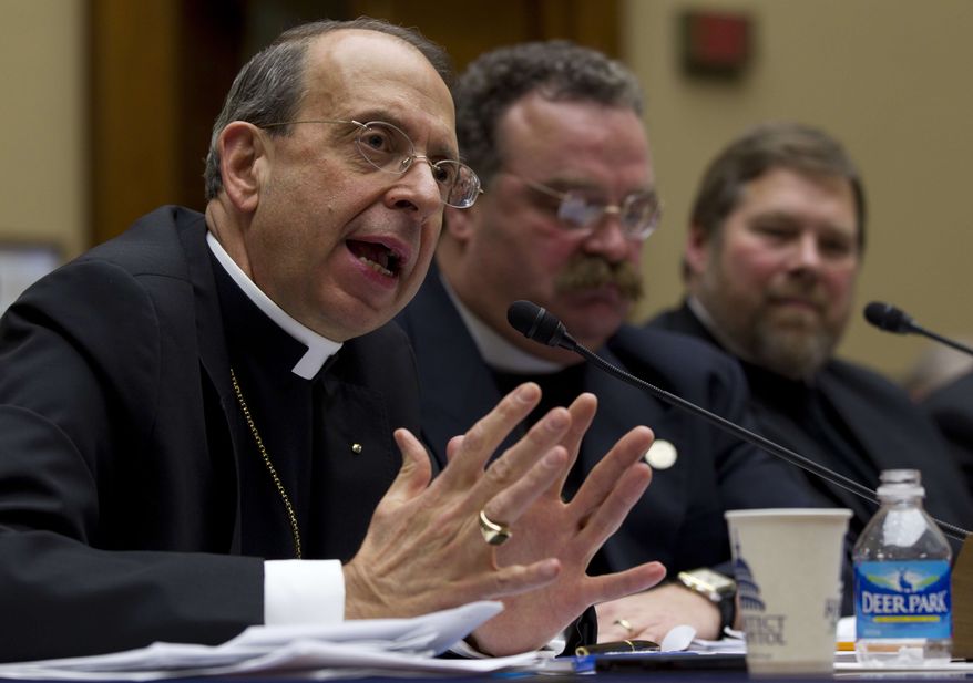 ** FILE ** The Rev. William E. Lori, Roman Catholic bishop of Bridgeport, Conn., gestures while testifying on Capitol Hill in Washington, Thursday, Feb. 16, 2012, before the House Oversight and Government Reform committee hearing: "Lines Crossed: Separation of Church and State. Has the Obama Administration Trampled on Freedom of Religion & Freedom of Conscience." From left are, Lori, the Rev. Dr. Matthew C. Harrison, president of the Lutheran Church Missouri Synod, and C. Ben Mitchell, professor of Moral Philosophy Union University. (AP Photo/Carolyn Kaster)