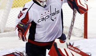 Washington Capitals goaltender Tomas Vokoun allowed four goals on 11 Ottawa Senators shots before being pulled in the second period of the 5-2 loss. (AP Photo/Alan Diaz)
