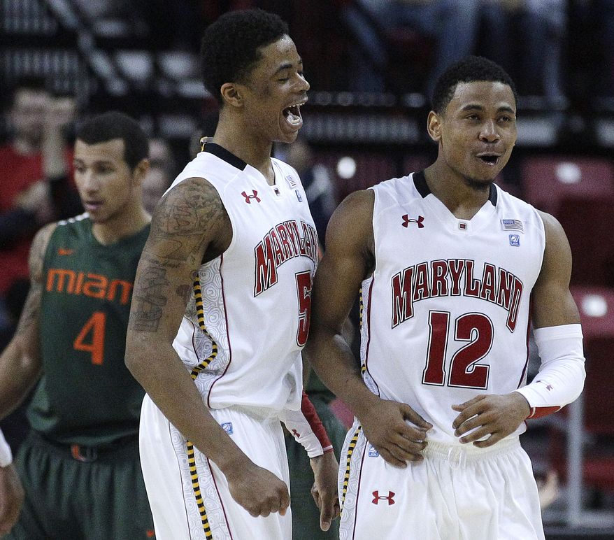 Maryland guards Nick Faust and Terrell Stoglin react after Miami turned the ball over in the second half in College Park, Md., Tuesday, Feb. 21, 2012. Maryland won 75-70. (AP Photo/Patrick Semansky)