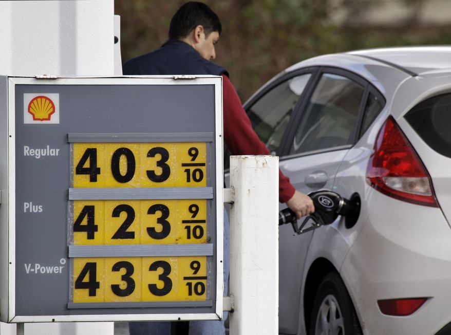 Prices for three grades of gasoline are posted Feb. 22, 2012, in front of a service station in Bellevue, Wash. (Associated Press)
