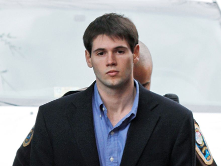 George Huguely V , left, is escorted into the Charlottesville Circuit courthouse in Charlottesville, Va., Wednesday, Feb. 22, 2012. The jury found him guilty of second-degree murder and grand larceny. (AP Photo/Steve Helber)