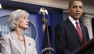 **FILE** President Obama, accompanied by Health and Human Services Secretary Kathleen Sebelius, announces the revamp of his contraception policy requiring religious institutions to fully pay for birth control on Feb. 10, 2012, at the White House. (Associated Press)