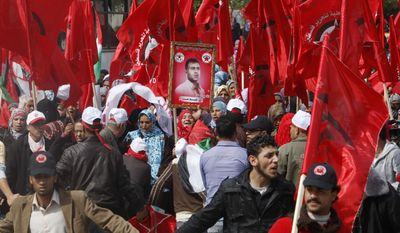 Palestinian supporters of the Democratic Front for the Liberation of Palestine wave their party&#39;s red flags during a Feb. 23, 2012, rally in Gaza City celebrating 43 years since its founding. (Associated Press)