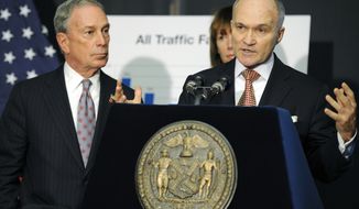 **FILE** New York City Police Commissioner Ray Kelly (right) speaks Dec. 29, 2011, at a news conference with New York Mayor Michael Bloomberg in the Brooklyn borough of New York. (Associated Press)