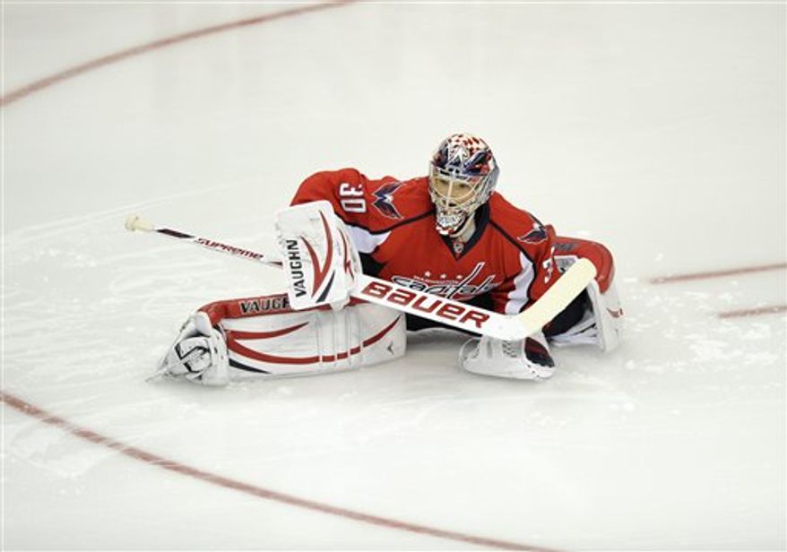 Michal Neuvirth made 30 saves on 31 shots in beating the Canadiens on Friday night. Associated Press / Nick Wass