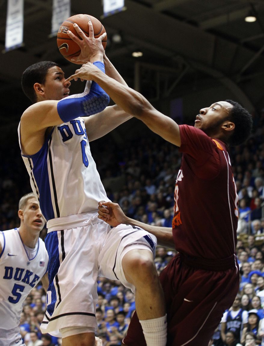 Duke's Austin Rivers shoots while Virginia Tech's Marquis Rankin defends during the first half in Durham, N.C., Saturday, Feb. 25, 2012. (AP Photo/Gerry Broome)